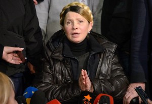 epa04096291 Ukrainian opposition leader Yulia Tymoshenko speaks to journalists as she leaves the Central Clinical Hospital in Kharkiv, Ukraine, 22 February 2014. Tymoshenko has been freed from her prison hospital in Kharkiv and is expected to be on her way to Kiev. The  former Ukrainian Prime Minister, who was sentenced to seven years in jail for abuse of office in 2011, said she will stand for president in May, the Itar-Tass news agency reported. The Ukrainian parliament on 22 February set early presidential elections for 25 May 2014.  EPA/ANDREW KRAVCHENKO