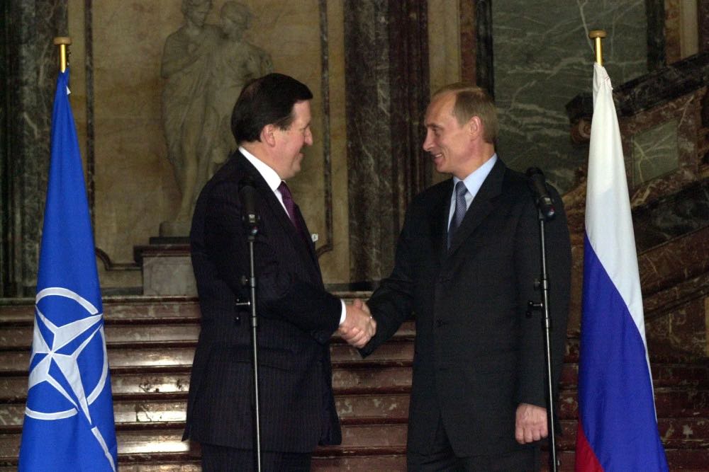 NATO Secretary-General George Robertson and Russian President Vladimir Putin meet in Brussels in October 2001